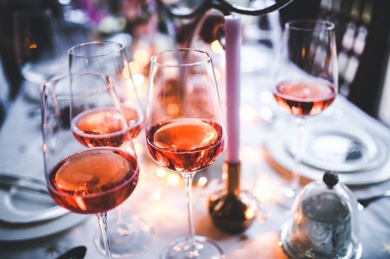wineglasses-with-red-wine-on-table-at-garden-party.jpg